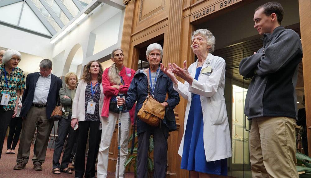 Dr. Lawrence in front of the Miner Library while leading a tour of “The Heritage Trail” for returning alums during Meliora Weekend, 2016.