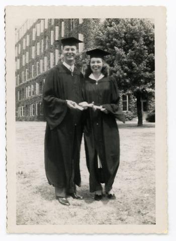 In caps and gowns, Ruth Anderson MD on URSMD Graduation Day standing beside her classmate and fiancé, Robert Lawrence MD, Class of 1949.